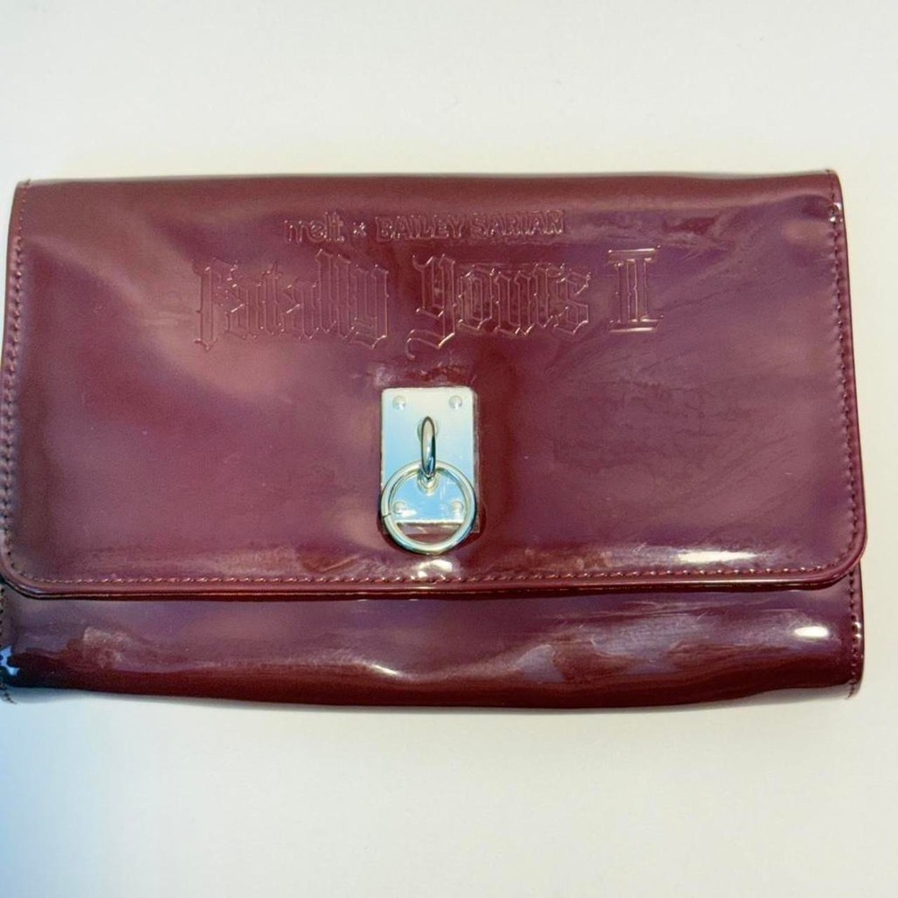 Melt x Bailey Sarian burgundy patent leather clutch. Clutch only